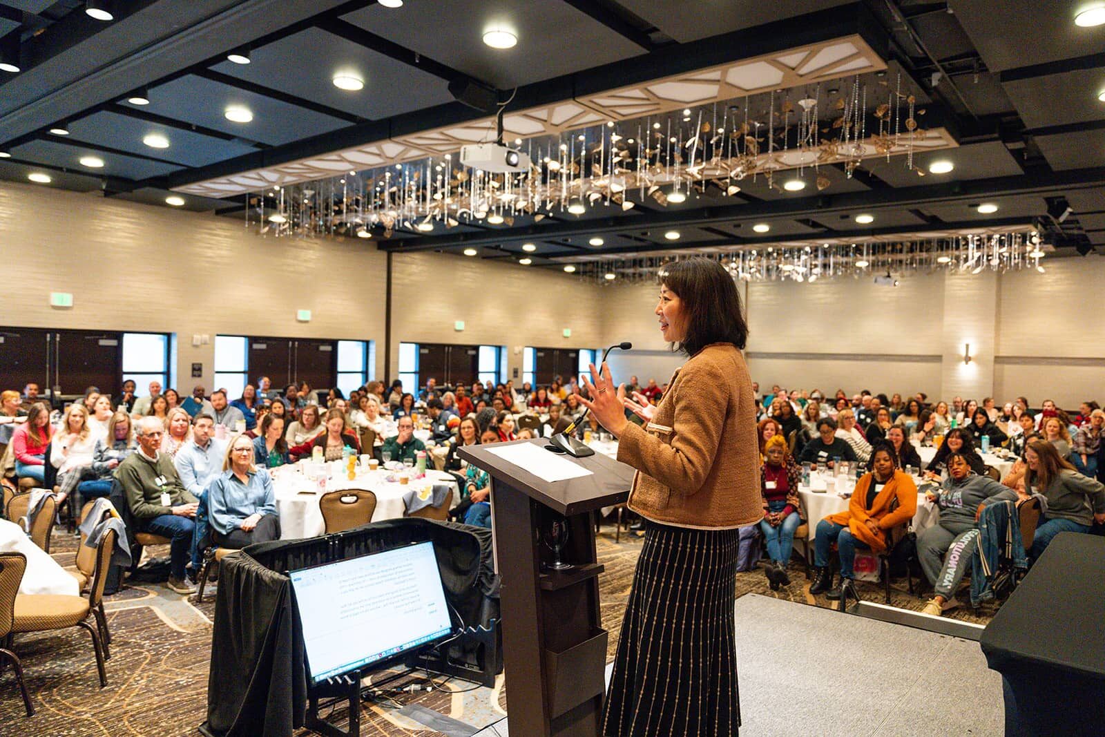 Annie Lee presenting to Colorado Access at a company meeting